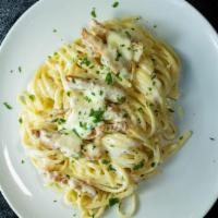Linguine Chicken Alfredo · Linguine pasta sauteed in a blend of cream and Parmesan cheese, then tossed with juicy tende...
