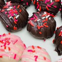 Cake Balls · Chocolate, red velvet or vanilla cake mixed with vanilla buttercream and dipped in chocolate
