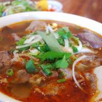 Bun Bo Hue · Spicy, sour, salty flavored soup with brisket, Vietnamese Bologna, sliced pork and rice nood...