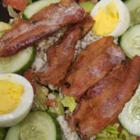 Cobb Salad · Romaine lettuce, cucumber, bacon, egg, avocado, chopped tomato, crumbled blue cheese with bu...