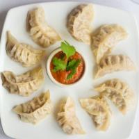 Momo · Minced of vegetable or chicken marinated with fresh ginger, garlic and nepali spices wrapped...