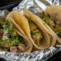 Street Taco  · One  street corn tortilla filled with your choice of meat, sprinkled with cilantro and onion...