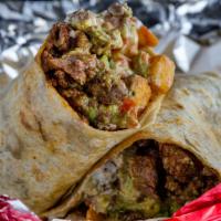 The California · Flour tortilla stuffed with seasoned steak(asada) and French fries, homemade guacamole and p...