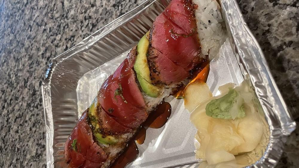 Tuna Amazing Roll · Spicy tuna, top with pepper tuna, avocado, and scallion, eel sauce.