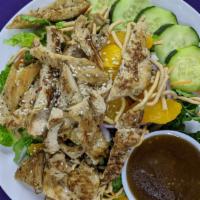 Asian Grilled Chicken Salad · Marinated ginger sesame grilled chicken breast on a fresh crispy bed of romaine lettuce topp...