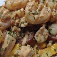 Seafood Fries · The Seafood fries are served with sausage, shrimp, crawfish tails, and chicken. Topped with ...