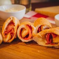 Stuffed Pepperoni Rolls · Mozzarella and pepperoni rolled together with our fresh pizza dough. Order of 6.