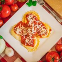 Cheese Ravioli · Cheese stuffed raviolis topped with homemade marinara sauce! Comes with an order of breadsti...