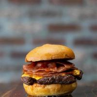 #5 Trenton Burger · Angus burger piled High with Grilled Pork Roll, topped with American Cheese and Ketchup, on ...