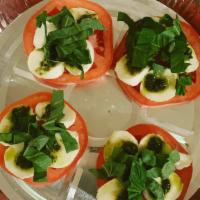 Caprese Salad · Slices of fresh mozzarella cheese with olive oil, fresh basil, balsamic reduction on fresh t...