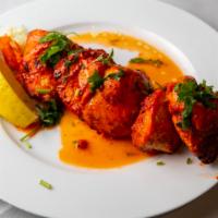 Chicken Tikka · Boneless cube of chicken breast marinated in yogurt and freshly ground spices finished in ta...