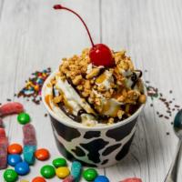Sundae · Single scoop with homemade whipped cream, two sauces, peanuts, and a cherry on top.