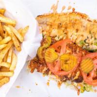 Catfish Po- Boy And Fries · Krispy fried catfish fillet, lettuce, pickeles, tomatoes, sweet pickles, Chunky's Sauce on f...