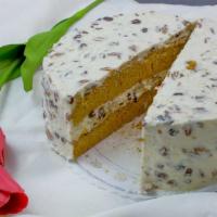 Carrot Cake · Two layers of carrot cake filled with cream cheese, raisins, nuts, and coconut. To insure th...
