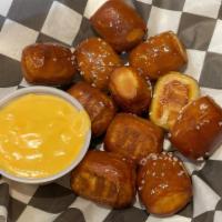 Pretzel Bites · Fried pretzel bites served with our rotating house-made beer cheese.