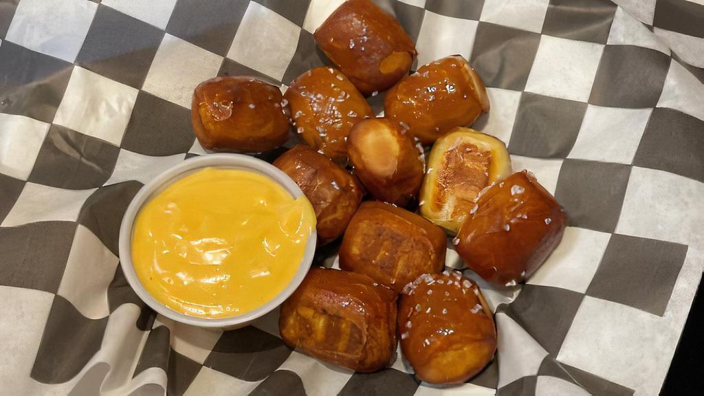 Pretzel Bites · Fried pretzel bites served with our rotating house-made beer cheese.
