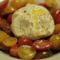 Burrata · Grape tomatoes, burrata, extra virgin olive oil and oregano.