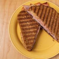 Blue Cristo · Honey ham, blueberry citrus sauce, Havarti cheese, and goat cheese grilled on wheat bread. C...