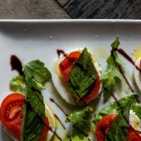 Caprese Salad · Tomato, fresh mozzarella, olive oil, balsamic vinegar, basil.  Accompanied by a glass of sel...