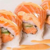 Salmon Lover Roll · Spicy Salmon and cucumber inside with more salmon on top.
(Raw salmon)