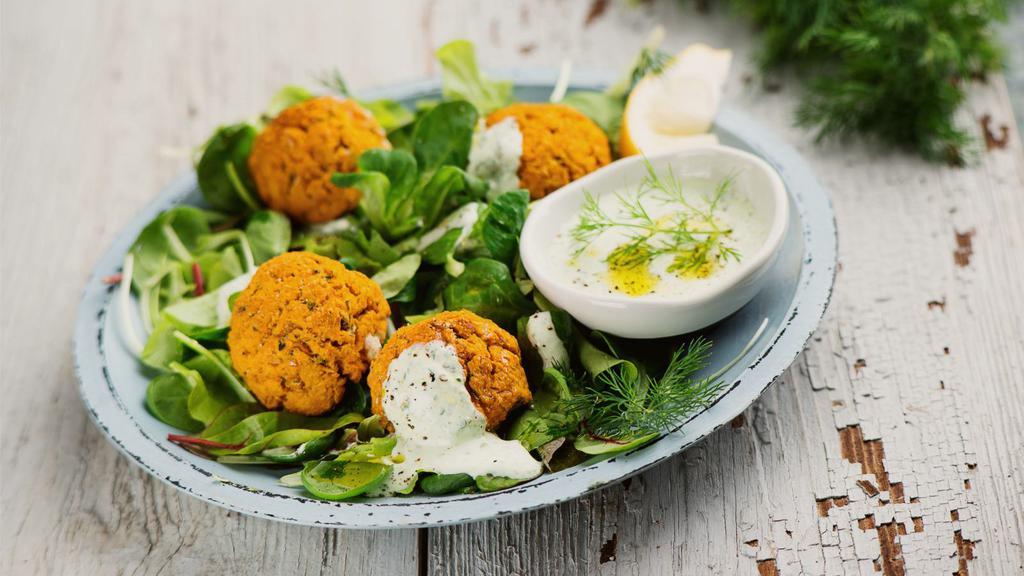 Falafel · Deep-fried balls of chickpeas ground with parsley, onions, garlic, and spices. Comes with a side of tahini sauce.