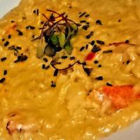 Lobster Risotto · steamed Maine lobster, creamy carnaroli rice, melted leeks, mascarpone cheese, lemon, & chive.