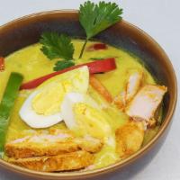 Chicken Khow Suey Noodle · Chicken,seasonal veggies prepared with Asian spices and coconut milk served with seasoned no...