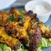 Tandoori Wings (5 Pieces) Gluten-Free · Five jumbo wings marinated in yogurt, spices and roasted in a tandoor oven.