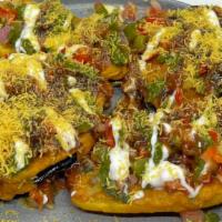 Eggplant And Potato Chat · crispy thin fritters tossed in mint, tamarind and yogurt sauce