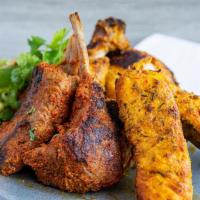 C & C Mix Grill · 2 Pieces each of Salmon, Chicken and Lamb Traditionally marinated in Indian Spices served wi...