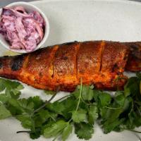 Bronzino (Tandoori Fish) · whole fish oven tandoori roasted in yogurt , garam masala , herbs to perfection