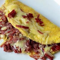 Corned Beef Omelet · Corned beef with two slices of Swiss cheese.