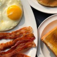 Special #1 · 2 X-Large eggs, hash browns or grits, choice of ham, bacon or sausage, and toast and jelly.