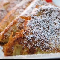 French Toast · Made on Fresh Texas toast with cinnamon and powder sugar.