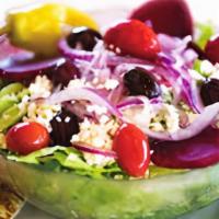 Greek Salad · Crisp bed of lettuce, topped with tomatoes, beets, Greek olives, onions, pepperoncinis, feta...