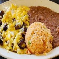 Scrambled Eggs With Sausage · Served with tortillas and a side of Mexican Rice and beans.