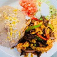 Plate #4 Chicken Fajitas · Served with rice, salad sour cream, guacamole, tomatoes, pinto beans and flour or corn torti...