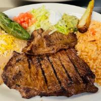 Plate #2 Carne Asada · Grilled steak served with rice pinto beans, grilled jalapeños lettuce, salad sour cream guac...