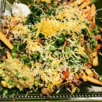 Super Fries · Baked Mexican street fries with melted cheddar cheese sour cream and guacamole. Meat choices...