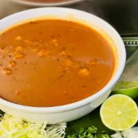 Pozole · Traditional Mexican soup made with hominy style maiz, pork and dried chiles. Served with fou...