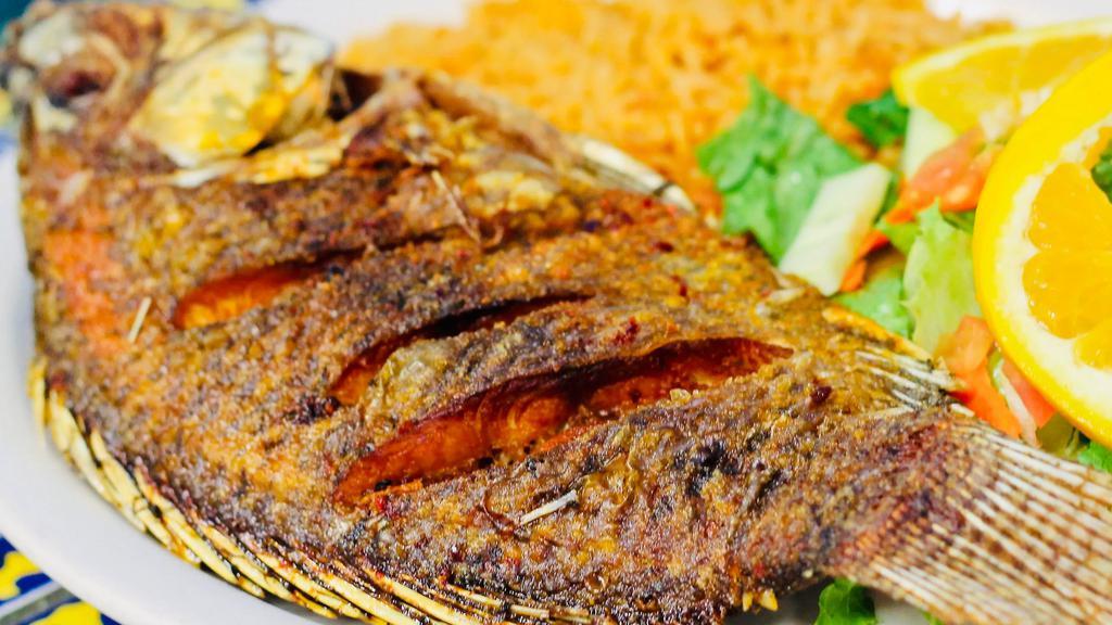Mojarra Frita · Fried whole tilapia fish served with rice and french fries. Served with rice and refried beans and sour cream, guacamole and tomato on top of shredded lettuce served on the side.