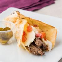Carne Asada Breakfast Taco · Chopped carne asada with cage-free scrambled eggs, a 4 cheese blend, and pico de gallo on a ...