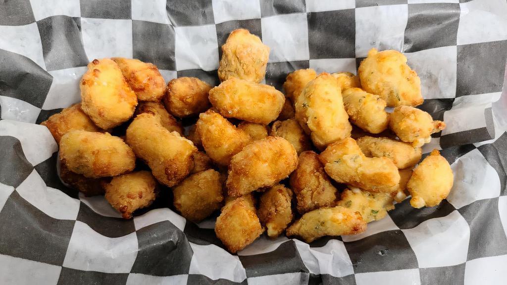 Cheesy Trio · There is nothing better than a big plate of fried cheese!  Our Cheesy Trio is a big plate of original, garlic, and jalapeno flavored curds.