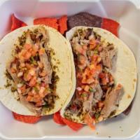 Pork Tacos · Two pulled pork tacos served with your choice of green chili aioli or basil pesto and pico. ...