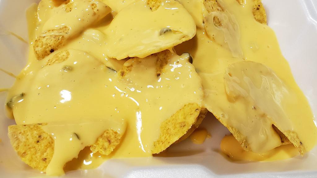 Plain Nachos · Down to the basic with nacho chips and cheese. Customize it your way though with some of our add-ons such as pico, beans, sour cream
