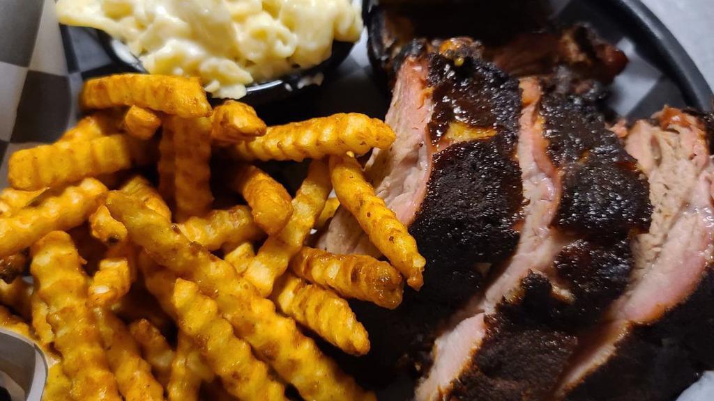Third Rack · NOTICE:  RIBS ARE ONLY AVAILABLE ALL DAY ON FRIDAY'S.  THE REMAINDER OF THE WEEK THEY'RE ONLY AVAILABLE AFTER 4:30PM.

Perfectly smoked and tender baby back ribs.  Served with your choice of two sides.  Third Rack includes approximately 4-5 bones.