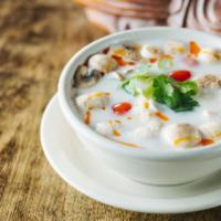 Tom Kha Soup · Lemongrass soup with coconut milk, cilantro, green onions, mushroom and tomatoes.