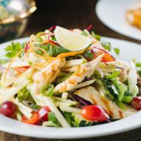 Yum Salad · Grilled beef or chicken in a tangy lemon vinaigrette, tomatoes, onions, cilantro, mint, cucu...