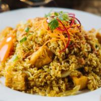 Yellow Curry Fried Rice · Fried rice with curry powder, onions, eggs, and tomatoes. Choice of tofu (vegetarian), chick...