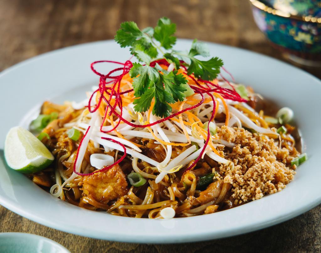 Pad Thai · Thin rice noodles, bean sprouts, tofu, eggs, crushed peanuts, scallions in a sweet tamarind paprika sauce.
